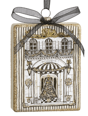 Gold glitter rectangular ornament depicting a Parisian boutique storefront with black ribbon bow