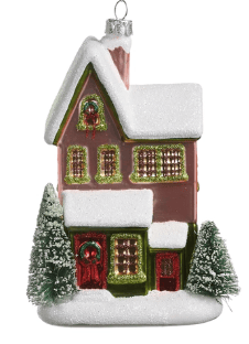 Pink glass house Christmas ornament with snow-covered roof and miniature evergreen trees