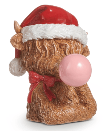Highland cow figurine wearing Santa hat and red bow, blowing pink bubble gum
