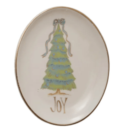 Oval stoneware dish with green Christmas tree illustration and gold rim, reads JOY