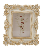 Ornate ivory resin baroque photo frame with gold accents displaying floral art