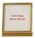Gold metal and glass frame with easel displaying 'Cold days warm hearts' saying