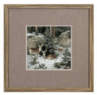 Framed winter forest deer scene print with burlap mat in wood frame