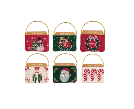 Six Christmas needlepoint gift card pouches with gold handles featuring holiday designs