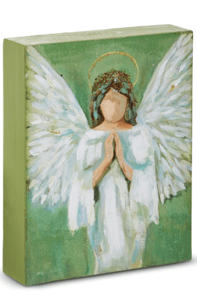 Painted wood block featuring a praying angel with white wings on green background
