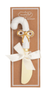 White and gold candy cane shaped cheese spreader with bow ribbon accent