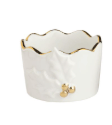 White ceramic tidbit dish with ruffled gold rim and small bee accent