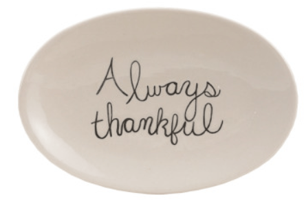White oval stoneware plate with black cursive Always Thankful fall saying