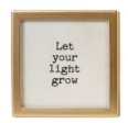Gold-framed magnet plaque with white background and black typewritten inspirational quote
