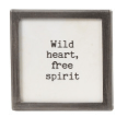 Small framed magnet with black text reading Wild Heart Free Spirit on white background