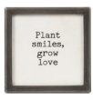 Small black metal and glass framed magnet reading Plant smiles, grow love