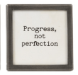 Small black framed glass magnet with Progress Not Perfection quote text