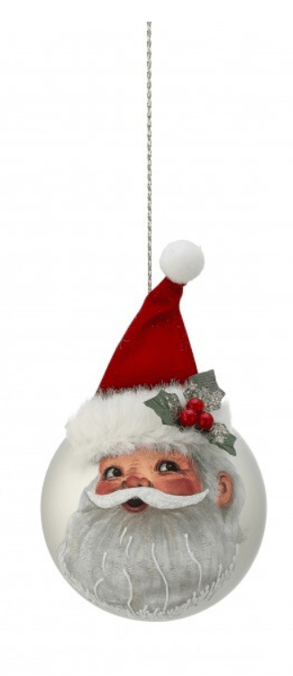 Glass ball ornament featuring Santa face with red felt hat and holly berries