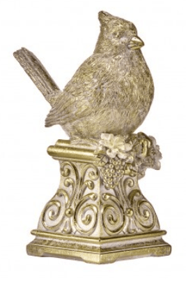 Gold and cream resin cardinal bird figurine perched on ornate scrollwork pedestal