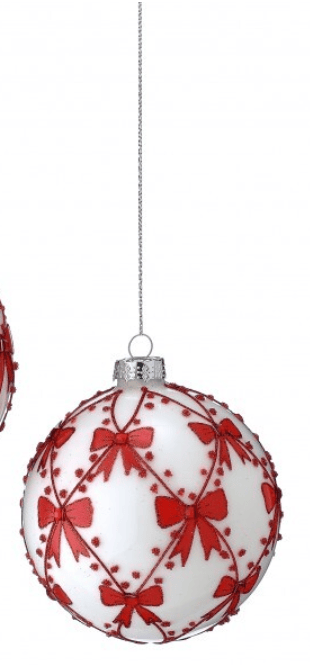 White glass ball ornament with red bow and berry lattice pattern