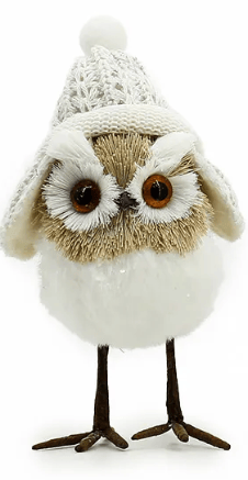White and tan bristle owl figurine wearing a knit winter hat with pom-pom