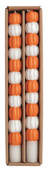 Two orange and white stacked pumpkin taper candles in kraft box packaging
