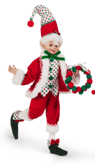 Posable Christmas elf figure in red suit with polka dot accents holding a wreath