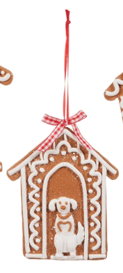 Gingerbread doghouse ornament with white icing, red bow, and small dog figure inside