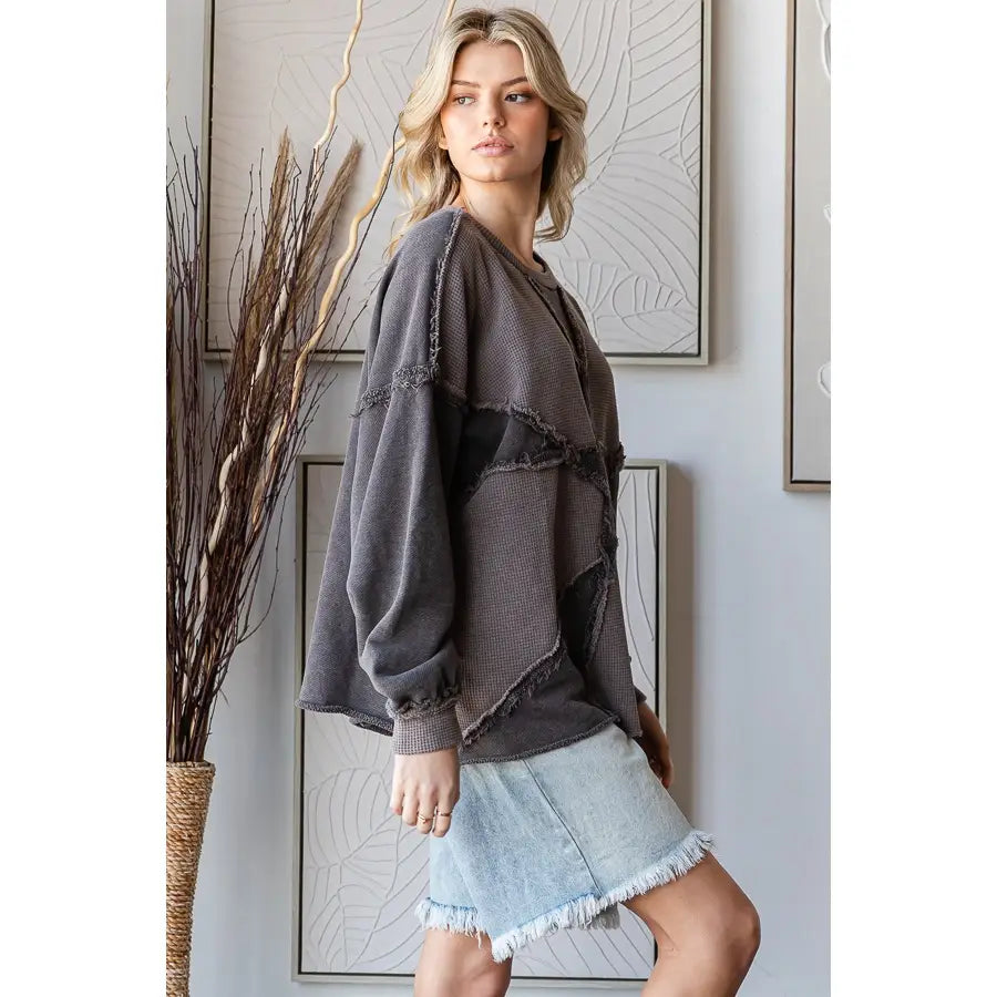 Washed charcoal patchwork waffle-knit pullover top with frayed seams and balloon sleeves