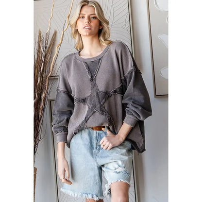 Charcoal washed star patchwork cotton pullover top with balloon sleeves styled with denim shorts