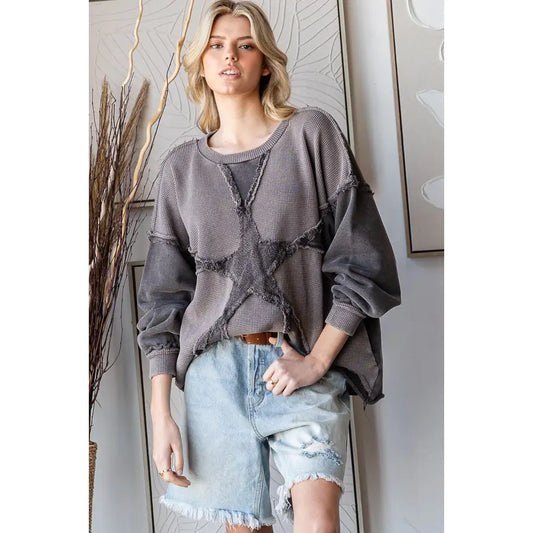 Charcoal washed star patchwork cotton pullover top with balloon sleeves styled with denim shorts