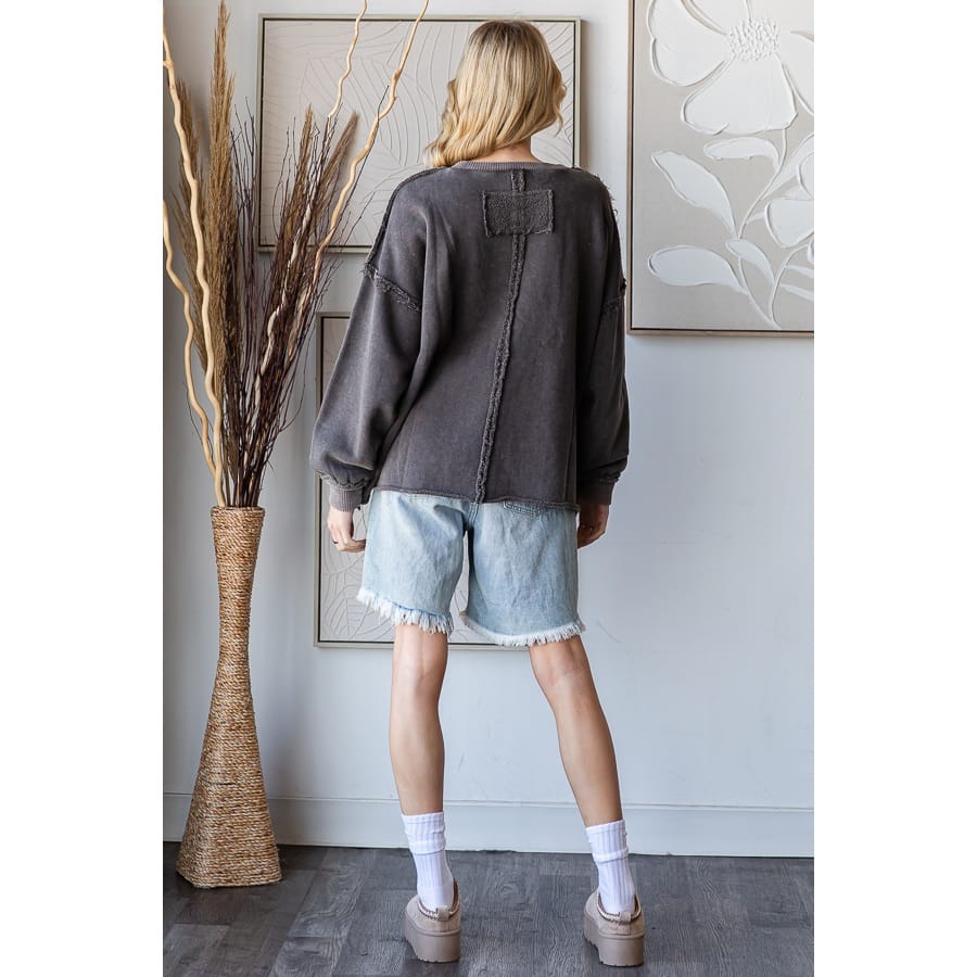 Washed charcoal pullover sweatshirt with patchwork cross detail and raw edge seams