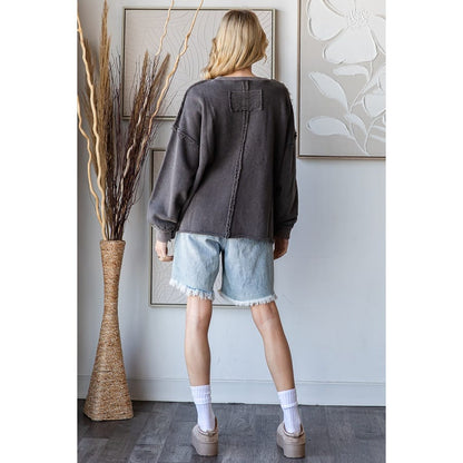 Washed charcoal pullover sweatshirt with patchwork cross detail and raw edge seams