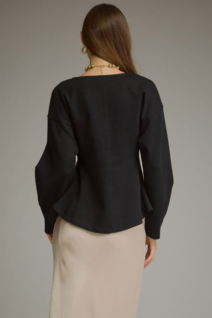 Entro black curved seam long sleeve top with balloon sleeves, back view