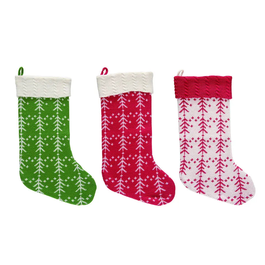 Knit Christmas stockings in green, red, and white with tree patterns, cable-knit cuffs