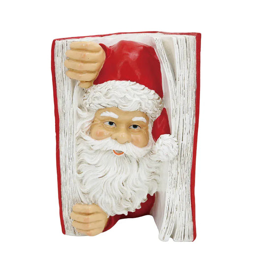 Resin Santa Claus figure peeking through open book pages holiday figurine