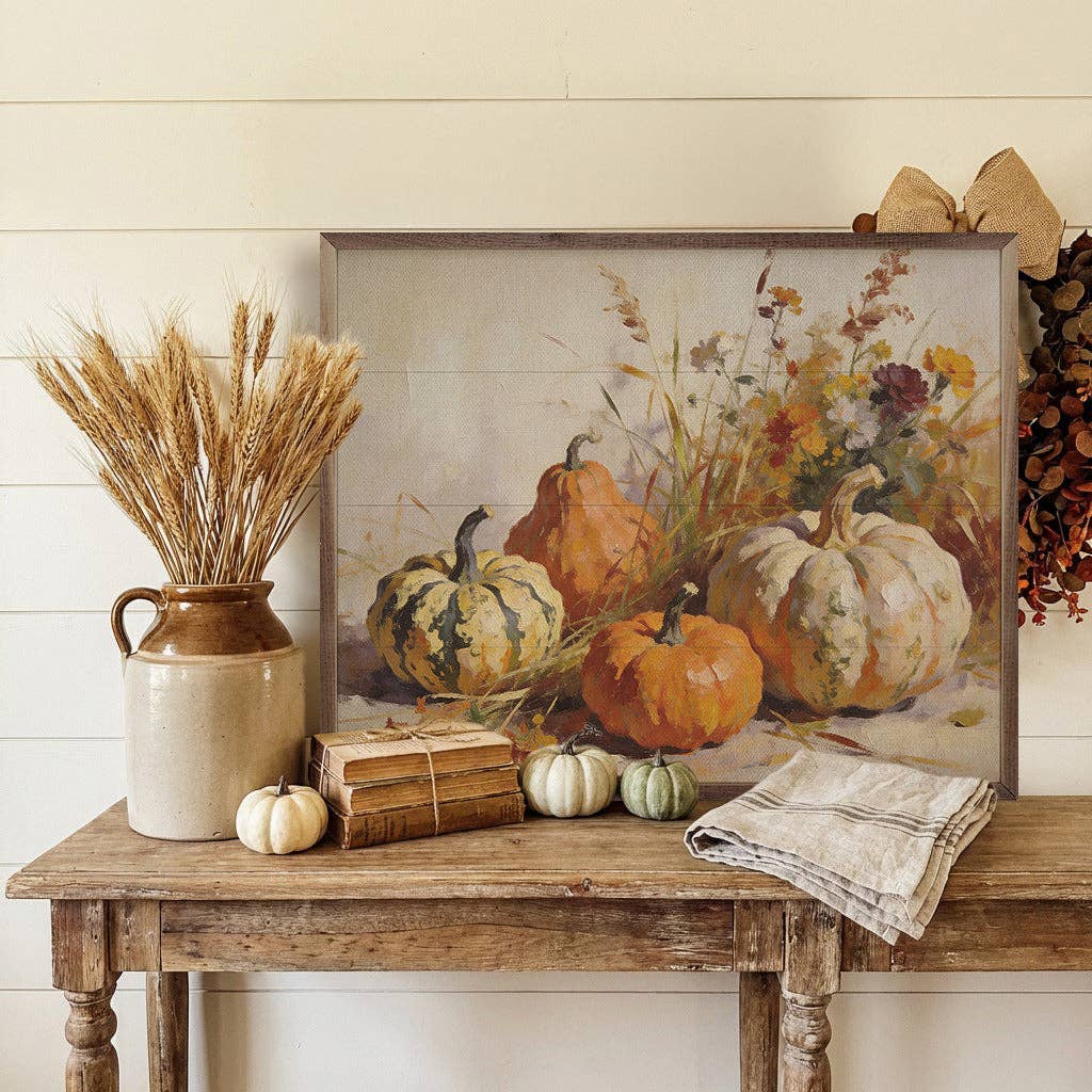 Framed fall pumpkin still life art print on rustic wood console table with harvest decor