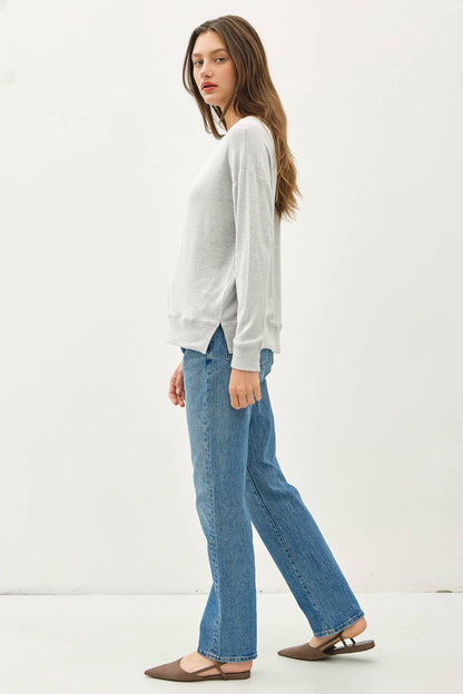 Light gray long-sleeve brushed hacci pullover knit top with ribbed cuffs and hem