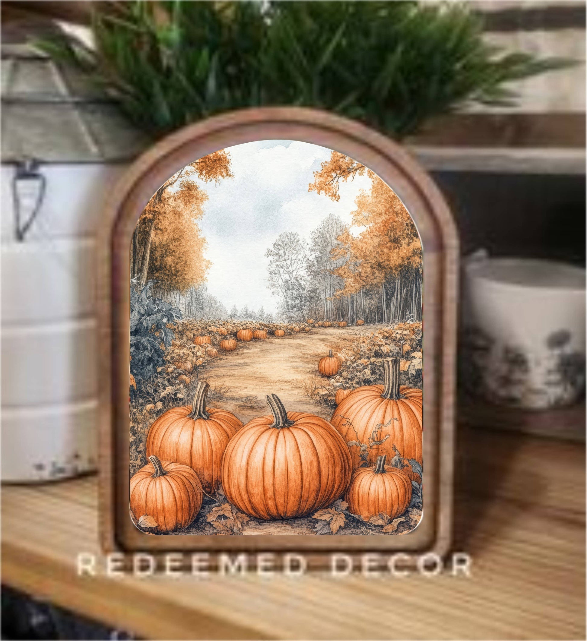 Arch-top framed canvas art depicting autumn pumpkin patch path with fall foliage