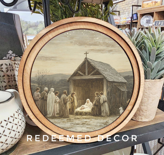 Round wood-framed nativity scene canvas art with warm neutral tones, 8 inch diameter