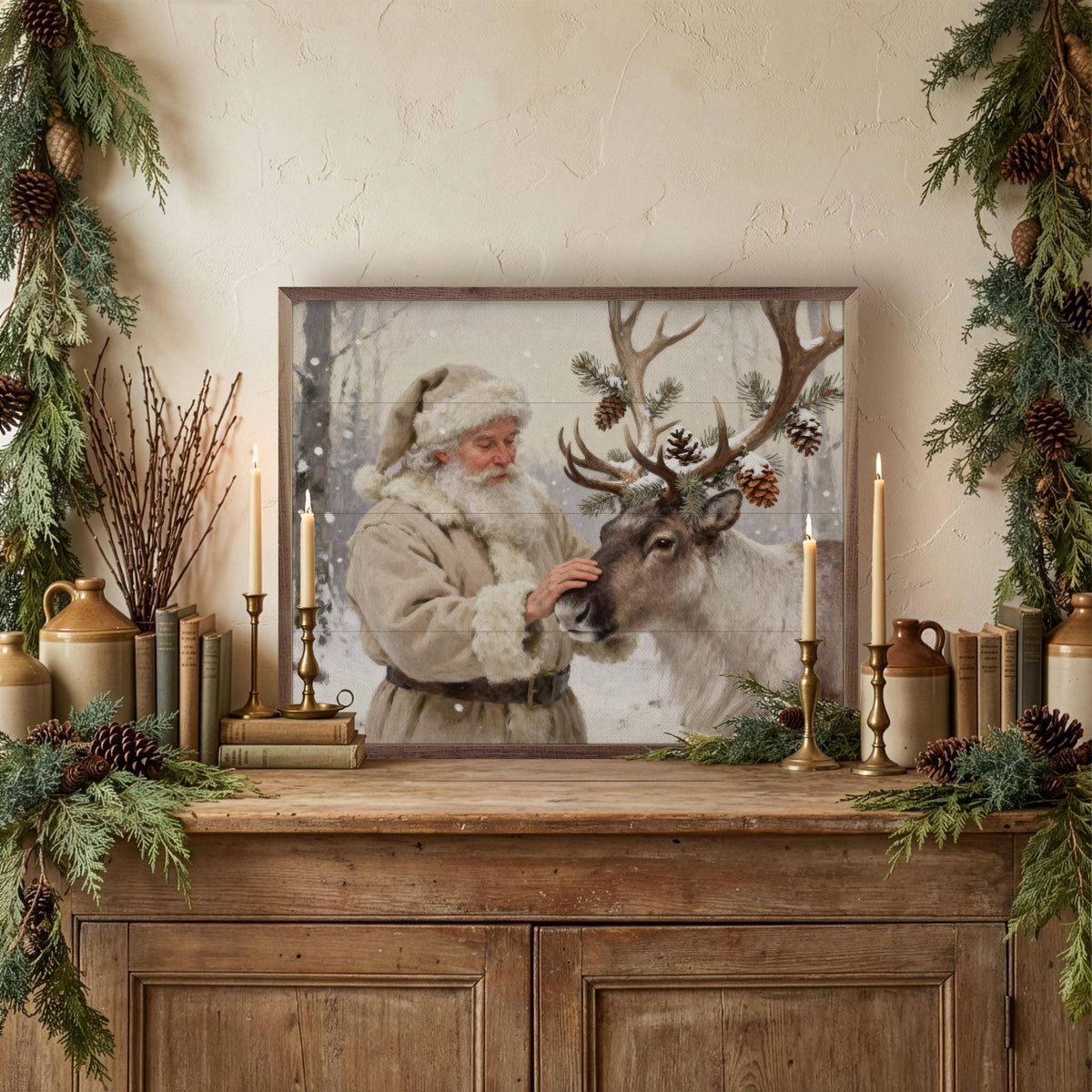 Framed Santa and reindeer wall art on rustic wood sideboard with candles and greenery