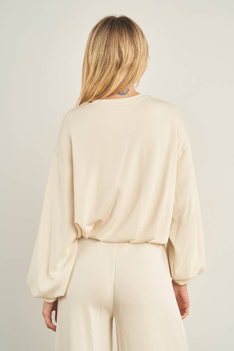 ANWND cream cropped crewneck sweatshirt with balloon sleeves, back view