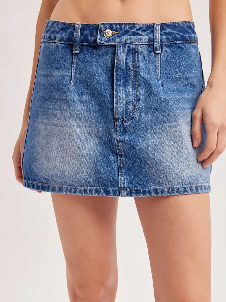Low rise blue denim mini skort with button closure and contrast stitching