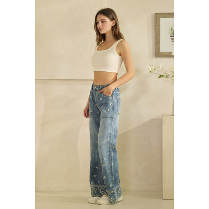 Wide-leg paisley print medium wash denim jeans with embroidered hem detail