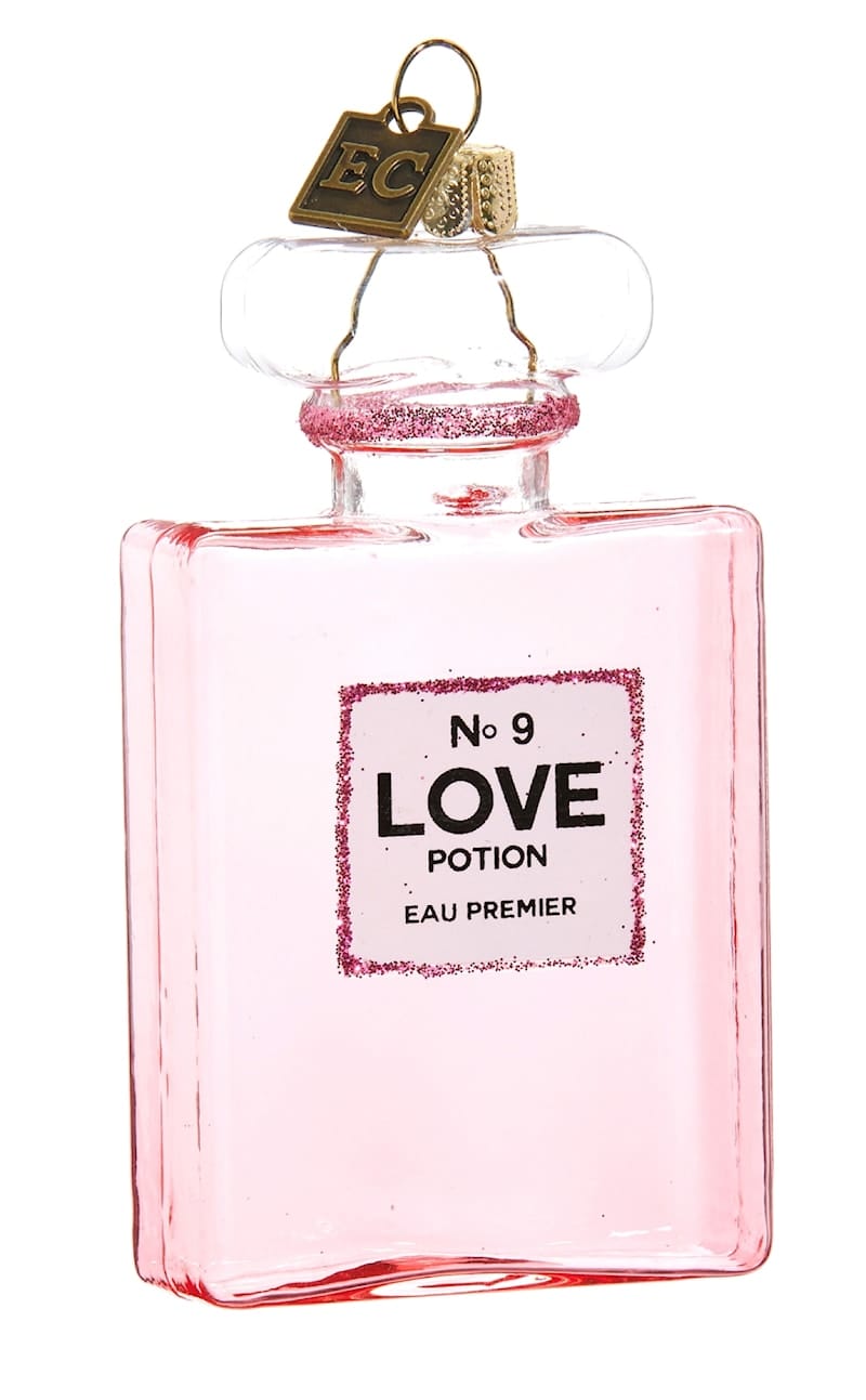 Pink glass perfume bottle ornament labeled Love Potion No. 9 with glitter accents and hanging loop