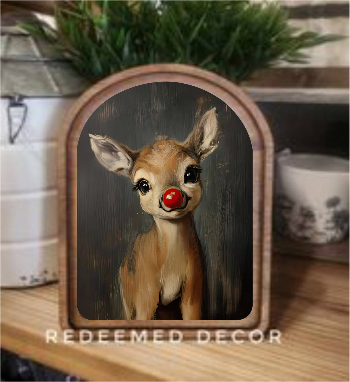 Arched wood-framed canvas art of Rudolph the red-nosed reindeer, dark background