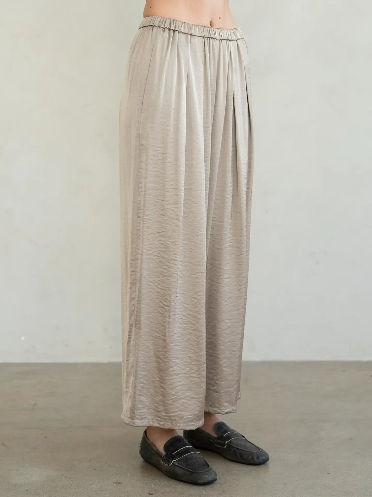 Champagne textured satin wide-leg pants with elastic waist and front pleats