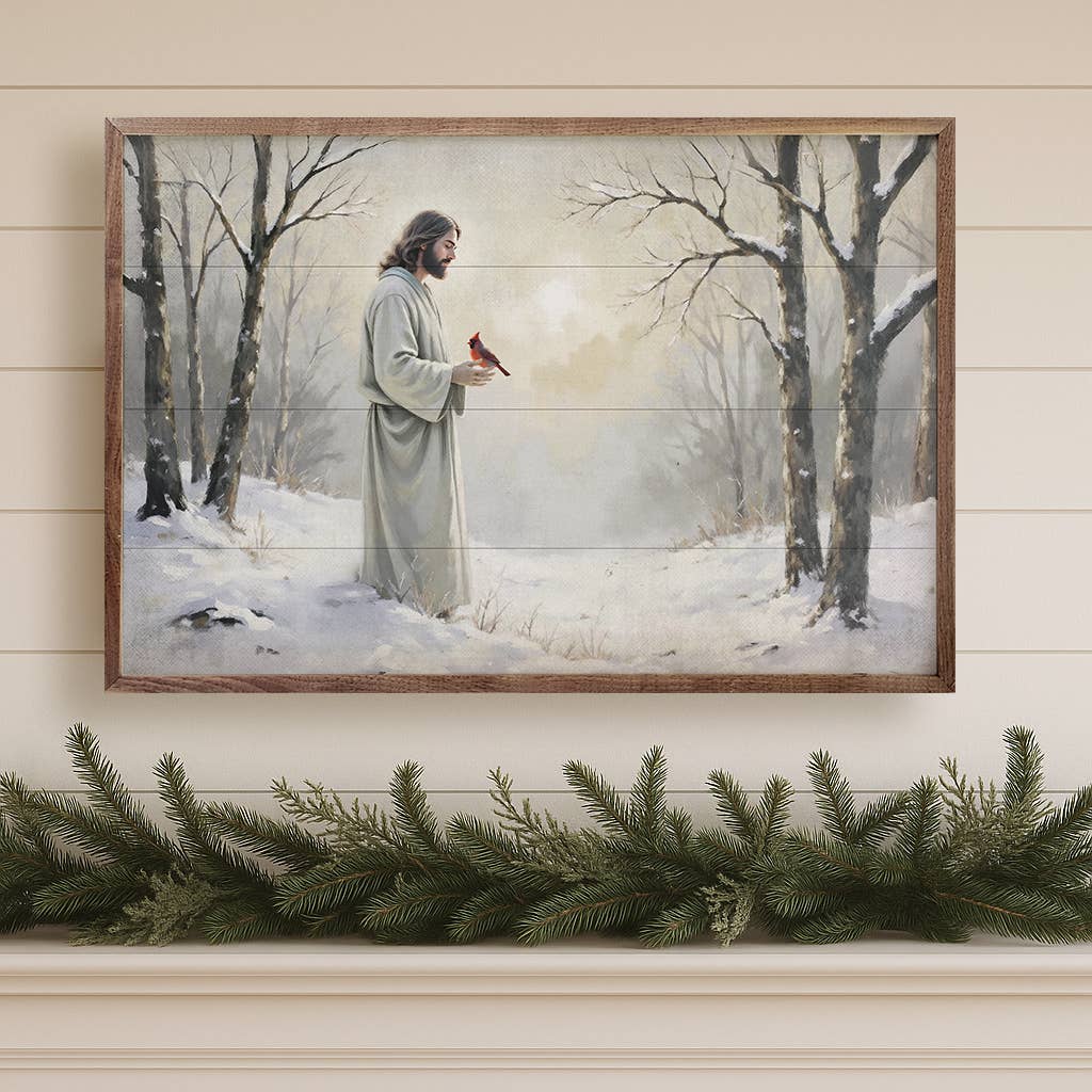 Framed wood print of Jesus holding a red cardinal in a snowy winter forest
