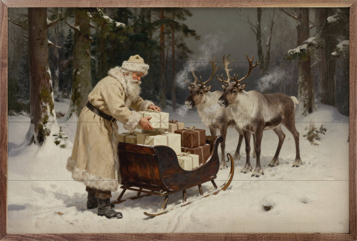 Framed oil painting of Santa in cream coat loading gifts onto wood sleigh with reindeer
