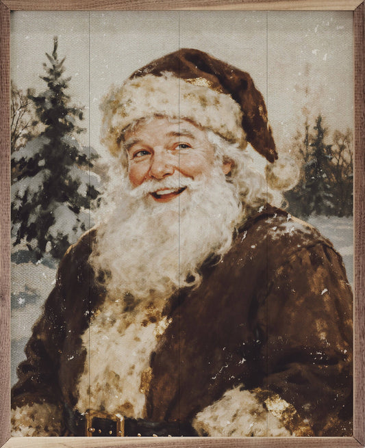 Framed vintage-style painting of smiling Santa Claus in brown fur coat, snowy forest backdrop