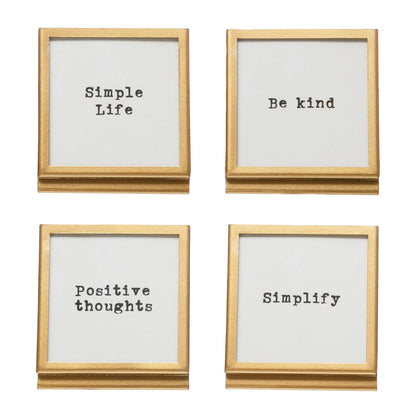 Set of four gold metal easel frames with motivational sayings on white inserts