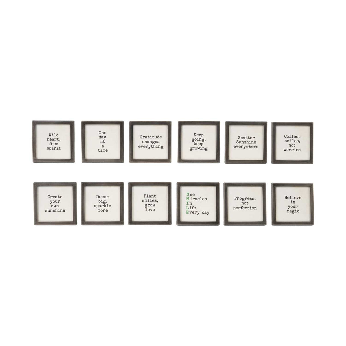 Set of 12 black metal framed glass magnets with inspirational sayings in black and green text