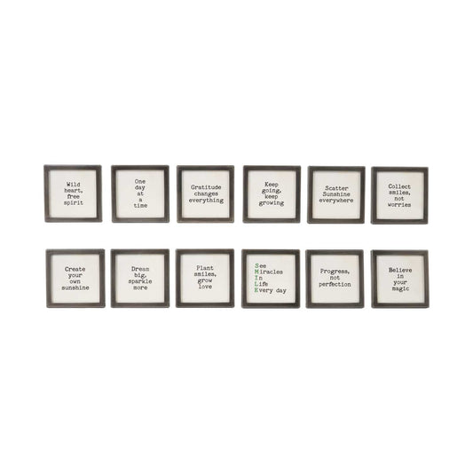 Set of 12 black metal framed glass magnets with inspirational sayings in black and green text