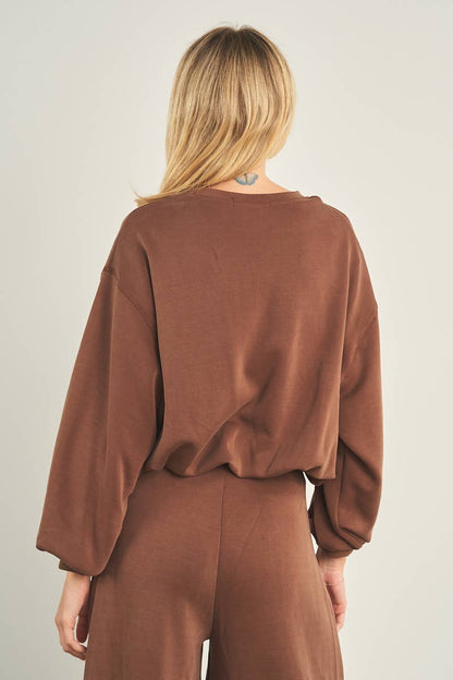 Cropped brown crewneck sweatshirt with balloon sleeves, back view on model