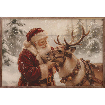 Framed wall art painting of Santa Claus petting a reindeer in snowy forest